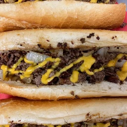 Classic cheesesteak sandwich with melted cheese and grilled onions.